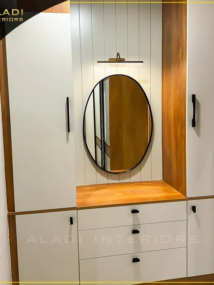 A closer look at the entryway unit, highlighting the sleek black handles and the warm wood tones that contrast beautifully with the white panels.