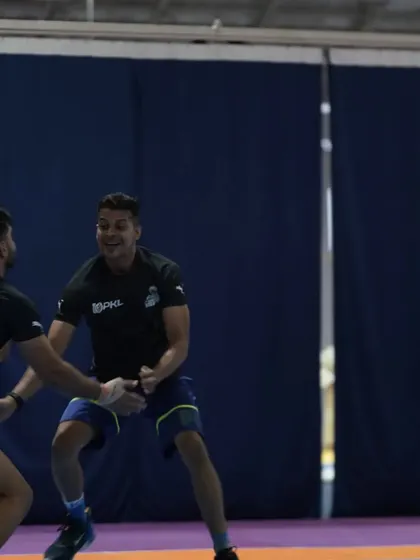 A playful moment of mock combat with the players. Team spirit is built on these interactions.