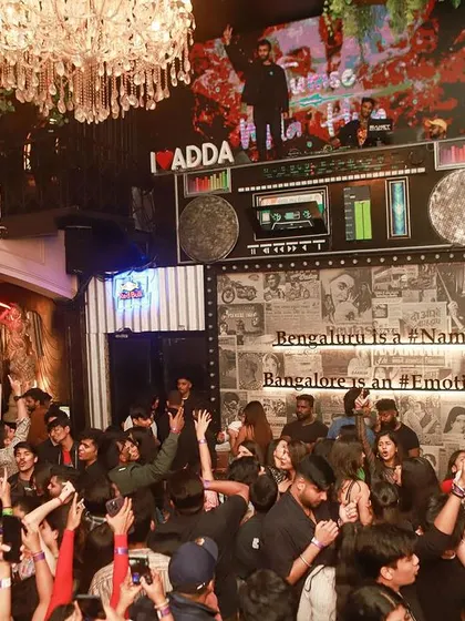 A full-crowd shot that captures the massive energy of a weekend night.