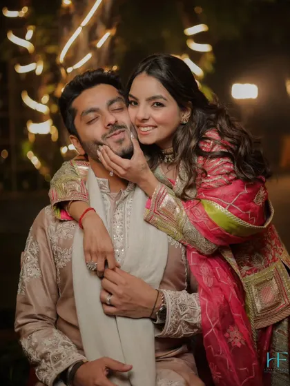 We believe the most beautiful moments are often the most genuine. This playful, candid shot captures the pure joy and affection between a couple. It's these unposed, happy memories that truly tell your story.