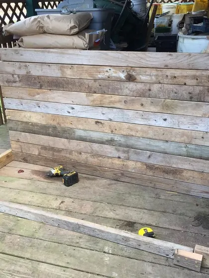 The back wall of the sifter stand, built from reclaimed pallet wood. We try to be resourceful and use what we have, but it's a constant balance between cost and durability.