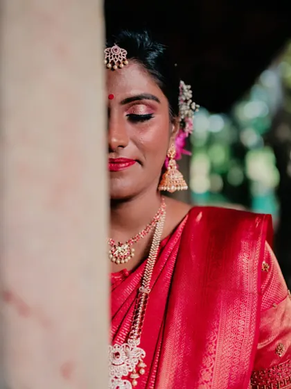 An artistic shot showing the detail of the eye makeup. The pink and gold tones are blended seamlessly for a sophisticated finish.