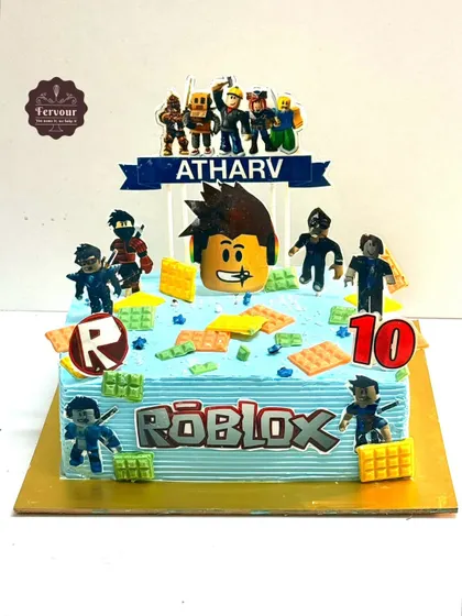 A fun Roblox-themed cake for a 10th birthday. This rectangular cake is decorated with various characters and elements from the popular game, making it a hit with young gamers.