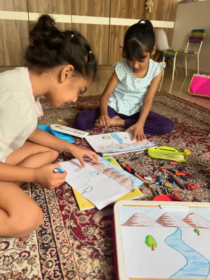 Our little artists learning about creating depth and distance in their art through a fun perspective drawing lesson. They are coloring in their landscapes of mountains and rivers.