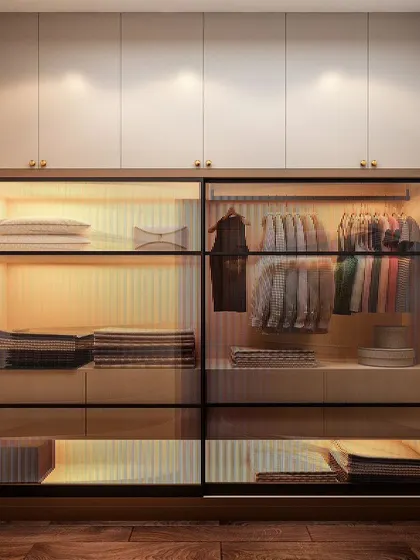 This wardrobe features sliding doors with translucent glass, offering a glimpse of the organized interior. The built-in drawers and shelves are illuminated with warm LED lighting, making it easy to find what you need.