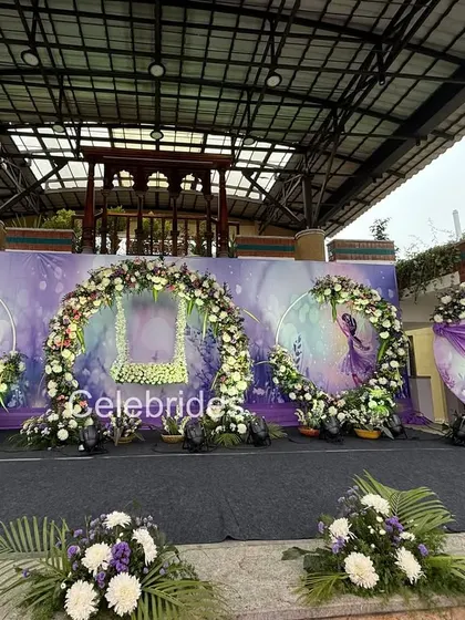 A beautiful lavender-themed naming ceremony. We used circular floral arches and a custom backdrop with a cradle illustration to create a dreamy and modern look.