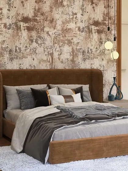A closer look at the bed and its textured accent wall. The hanging pendant lights on either side provide warm, ambient lighting, perfect for evening relaxation.