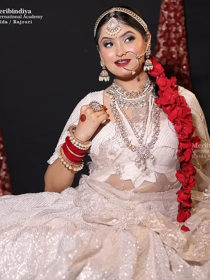 This look showcases a simpler headpiece, allowing the dramatic floral braid to be the star of the hairstyle.