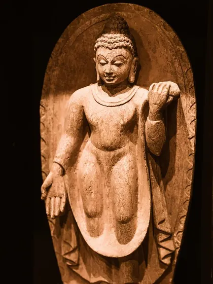A beautifully aged wooden Buddha sculpture, carved in the historic Pala dynasty style. Its warm, sepia tones and serene expression make it a collector's dream, adding a touch of palatial finesse to your decor.