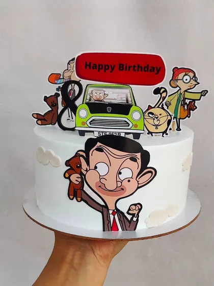 A funny Mr. Bean theme cake, complete with his iconic green car and Teddy. This is a great choice for fans of the classic comedy.