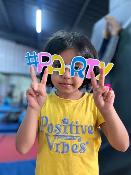 Positive vibes only. This student's shirt and her party glasses say it all.