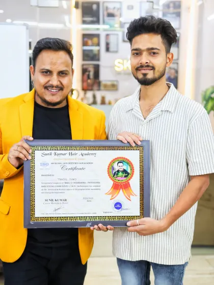 Handing over the certificate to another talented student from Batch 71. My academy is open to everyone who has a passion for hairstyling.