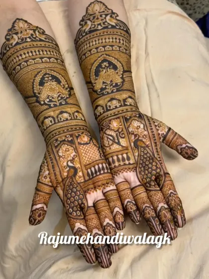 A beautiful and intricate design with peacocks on the palms and traditional motifs covering the arms. The fine line work is a testament to my years of experience.