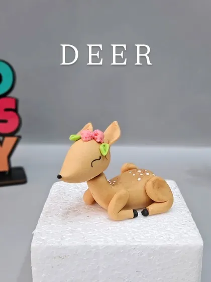 A fondant deer, one of the five cute jungle animals you'll learn to model in our Jungle Themed Cake Masterclass.