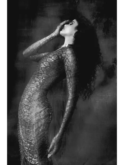 This image from "Judith" captures a moment of dramatic emotion. The pose and the moody, atmospheric lighting are central to this fine art photography series, translating a classical story into a modern visual.
