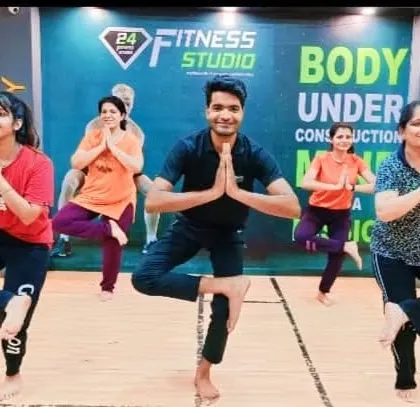 A happy group session at a fitness studio in Malviya Nagar, Delhi. I lead group classes that are energetic, fun, and suitable for all levels. Here we are practicing Vrikshasana, the tree pose, to improve balance and concentration.