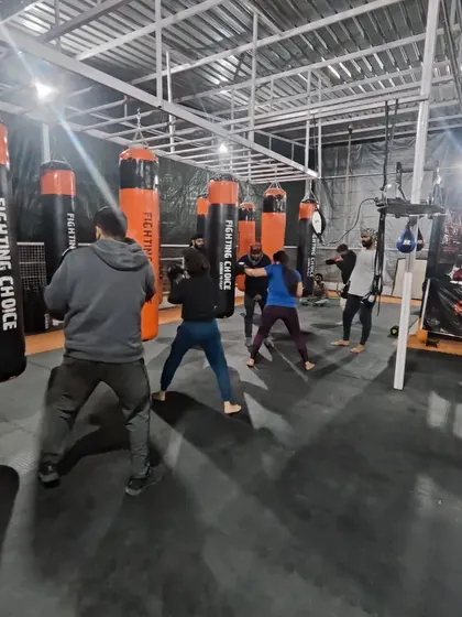 A group of members works on their boxing technique on the heavy bags at our Noida Extension club. The energy is always high.