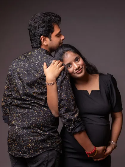 A tender and quiet moment of embrace. This pose is perfect for showing the supportive and loving bond between partners.