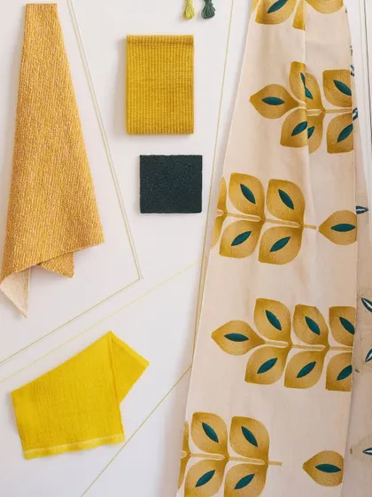 A fabric flat lay from the Élitis 'I'm Not Afraid' collection. The combination of bold patterns, vibrant embroidery, and a fearless palette showcases a collection that is unapologetically expressive.