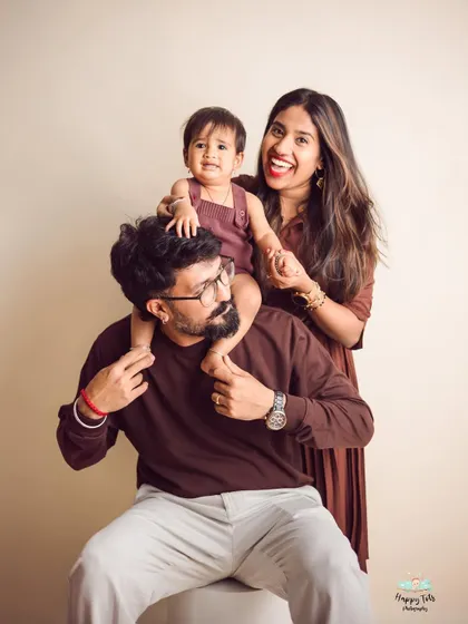 So much happiness in one photo. This family portrait captures a genuine moment of joy and connection, with everyone's personality shining through.