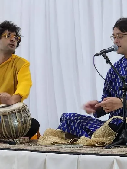 A moment of interaction on stage with Sounak da. These small exchanges guide the direction of the music.