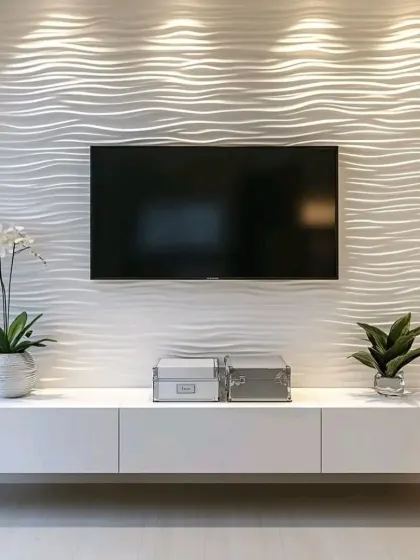 This minimalist TV unit features a stunning 3D wave-textured wall panel that creates a sense of movement and artistry. The simple white floating console below provides storage without distracting from the wall's impact.