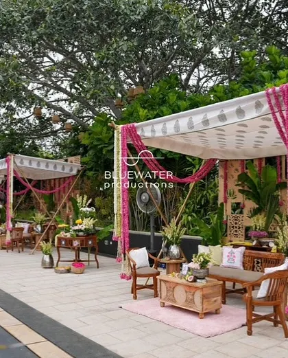 Multiple traditional canopies line the poolside, creating intimate and beautifully decorated spaces for guests to enjoy the Haldi ceremony.