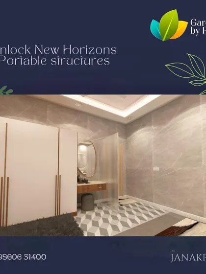 A render of a portable structure's interior, designed as a modern and elegant bedroom and dressing area. The space features a clean white wardrobe, a sleek vanity, and sophisticated marble-textured walls.