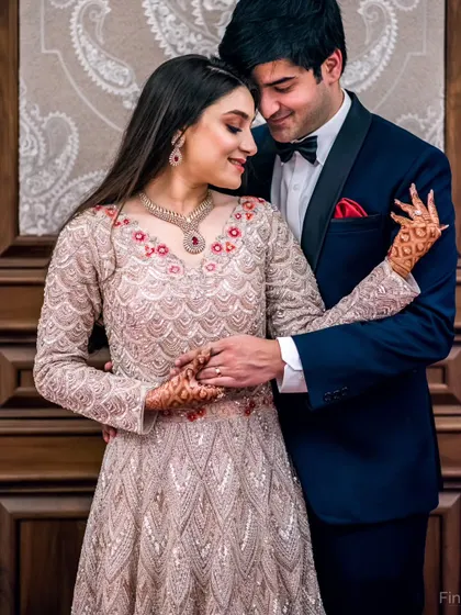A romantic embrace captured during a reception. The couple's pose and the soft lighting highlight their elegance and connection.