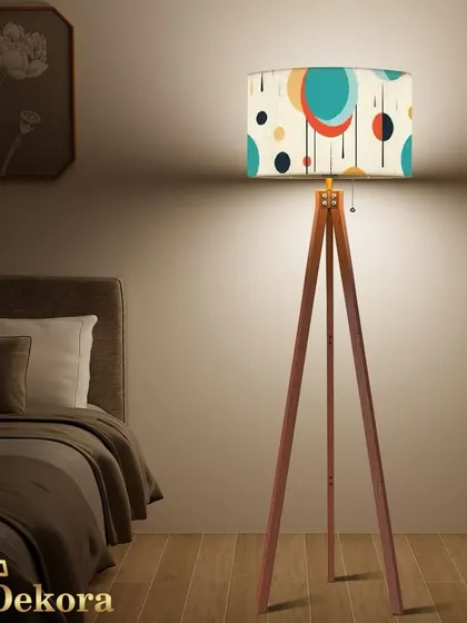 Express your personality with our tripod floor lamp featuring a colorful, mid-century modern patterned shade. This design is perfect for adding an artistic and vibrant touch to a bedroom or creative workspace.