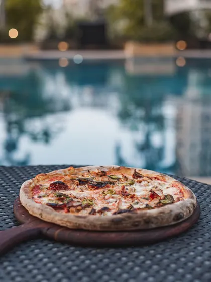 Pizza by the pool? Absolutely. Our mobile catering setup is versatile enough to bring the wood-fired experience to any location, turning your poolside party into a gourmet event.