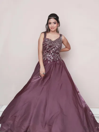 A full-length shot showcasing the entire gown. This gives a complete view of the outfit and is an essential part of any glamour or fashion-style photoshoot.