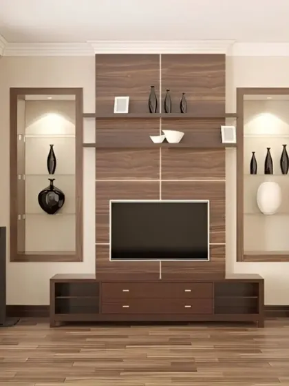 A classic, symmetrical entertainment center in a rich wood finish. It features two tall, glass-lit display cabinets perfect for showcasing decor, flanking the central TV and storage console.