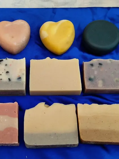 A close-up of my soap collection, showing the different shapes and natural ingredients. I have bars for every preference, from simple and unscented to complex and aromatic.