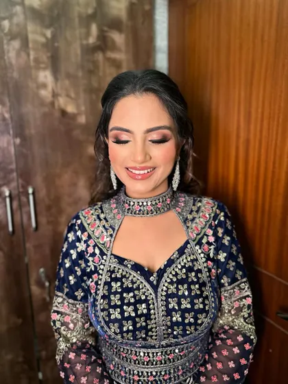 A final look at Heer's stunning sangeet makeup, with her eyes closed to showcase the detailed eyeshadow work.