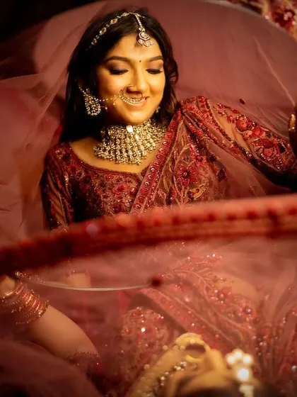 A playful and candid moment. Jenisha's makeup looks flawless even in motion, capturing her happy and carefree spirit.
