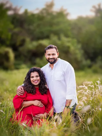 A closer shot of the couple, focusing on their happy expressions and the connection between them. Even without the pet in focus, the love in the family is clear.