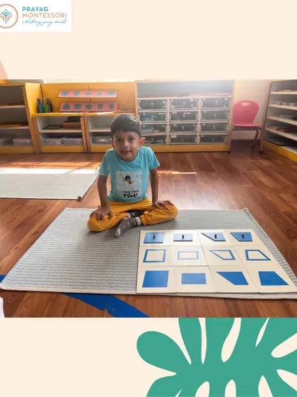 A student engages with the Geometry Cabinet. This material introduces various geometric shapes, helping develop fine motor skills and a foundation for geometry.