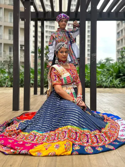 A full view of our coordinated couple's set, showing how the different patterns and colors come together to create a cohesive and festive look.