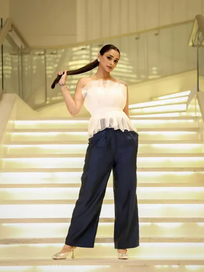 A full-length view of the modern, chic look. The makeup is natural and fresh, proving my versatility in creating different styles for the same client.