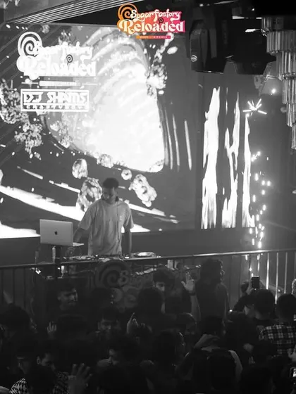 A black and white shot from the upper level at Sugar Factory Reloaded, showing the grand scale of the venue and my place within it.