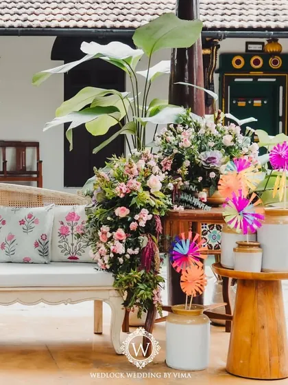 A closer look at the carnival-themed Mehendi decor. We used custom-printed cushions, lush floral cascades, and colorful pinwheels to create a festive and whimsical atmosphere.