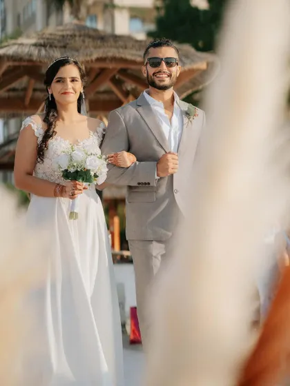 The bride walking down the aisle with her father, a classic and emotional moment in any wedding.