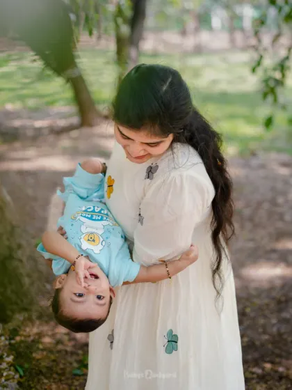 From tiny toes to glowing smiles, this is what love looks like. A candid moment of play between mother and child.