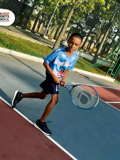A summer camp participant moves quickly across the court, eager to learn and play.