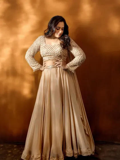 A confident pose from Spruha Varad, showcasing the full effect of her Filmfare red carpet attire.