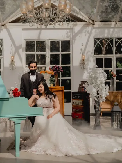 Another creative use of props at Picture Villa. The piano and soft smoke effect add a layer of dreamy romance to this intimate moment between the couple.