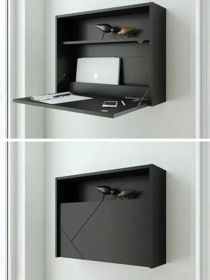 Another design for a foldable wall-mounted desk, this one in a sleek black finish with a modern, geometric front panel.
