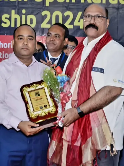 Receiving an award at the 13th National Karate Championship organized by our West Bengal branch. It was a proud moment for our entire federation.