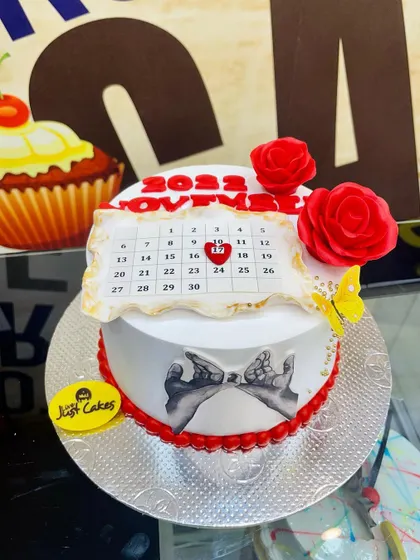 A romantic 1.5kg anniversary cake featuring an edible calendar marking the special date.